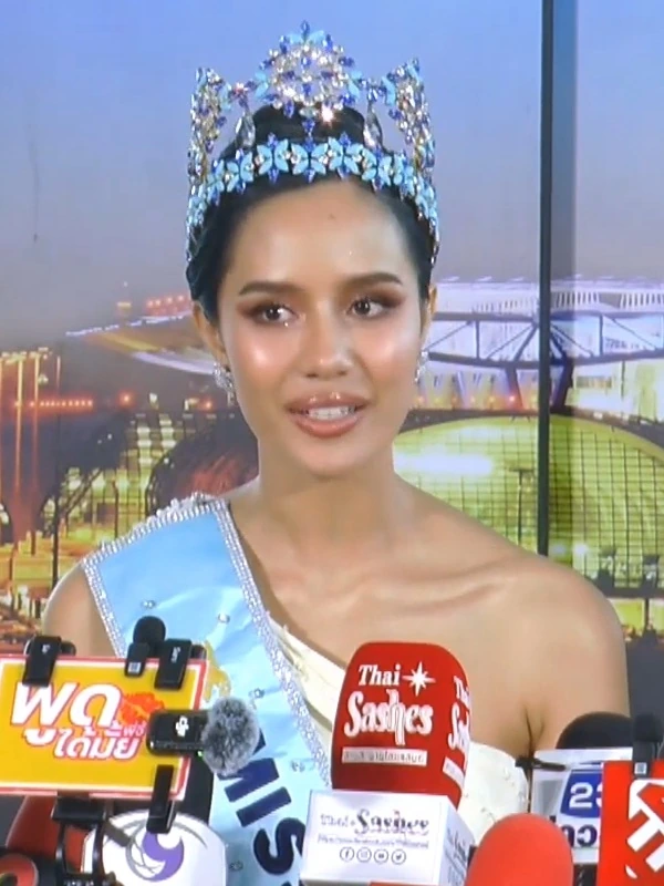 Opal Suchata Chuangsri wearing a crown and sash during a press event
