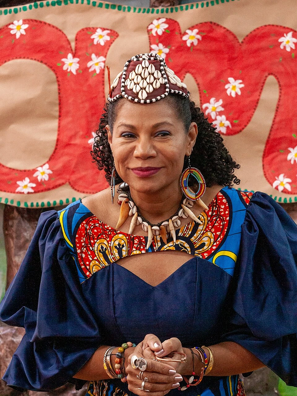 Portrait of Queen Diambi Kabatusuila Tshiyoyo Muata in traditional attire and ceremonial jewelry